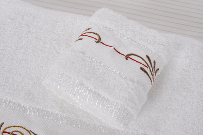 White embroidered hospitality towels